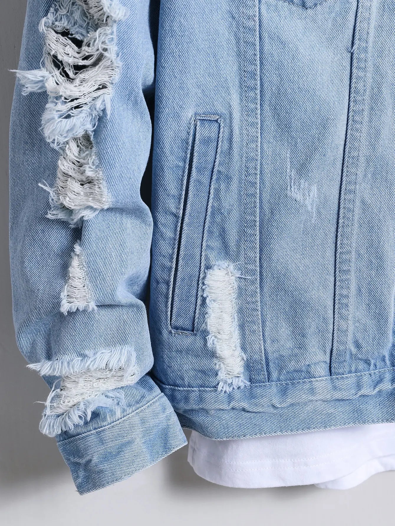 Light blue ripped denim jacket