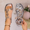 stylish silver sandals with floral decorations